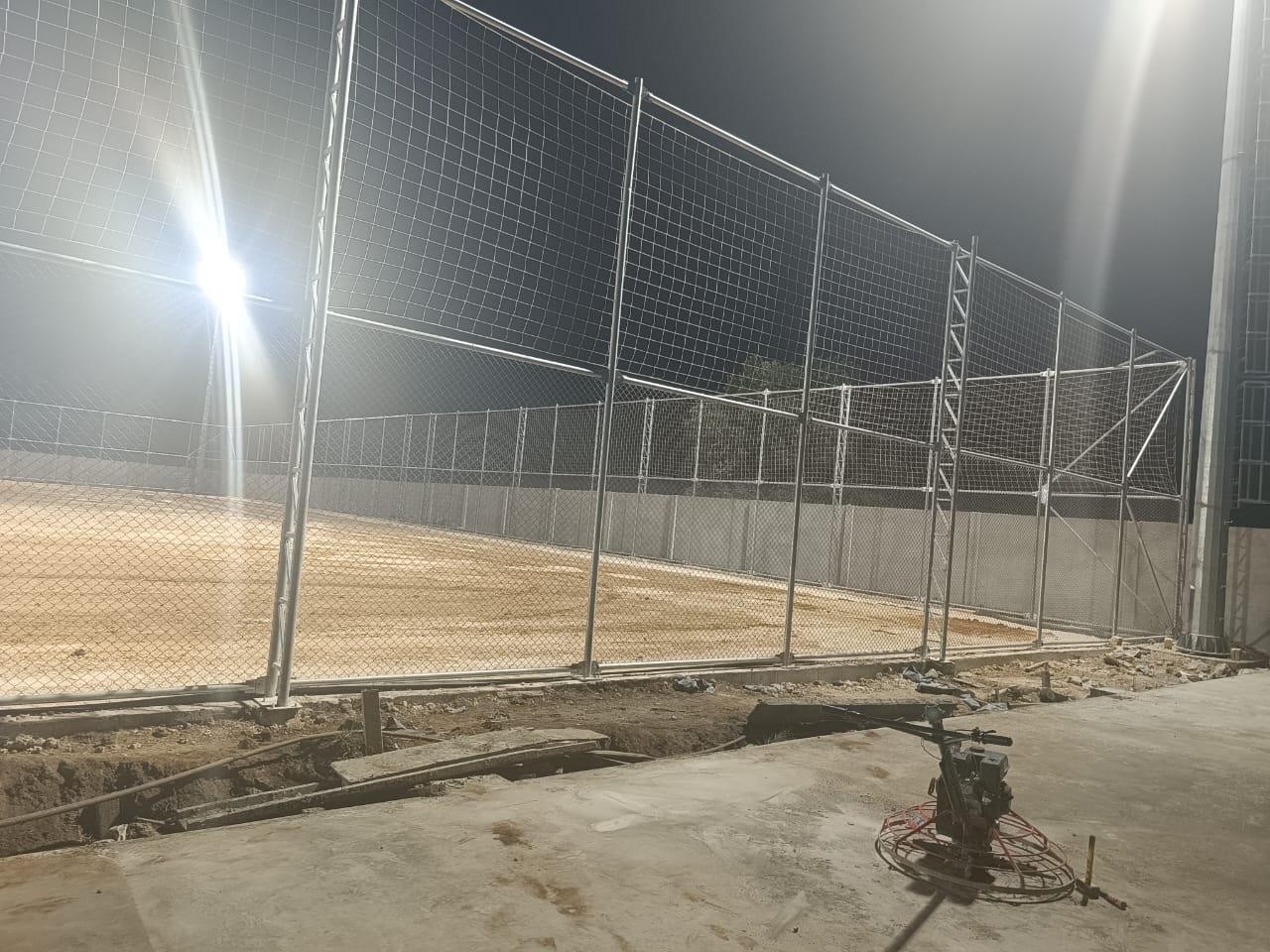 MUGA fencing under floodlights
