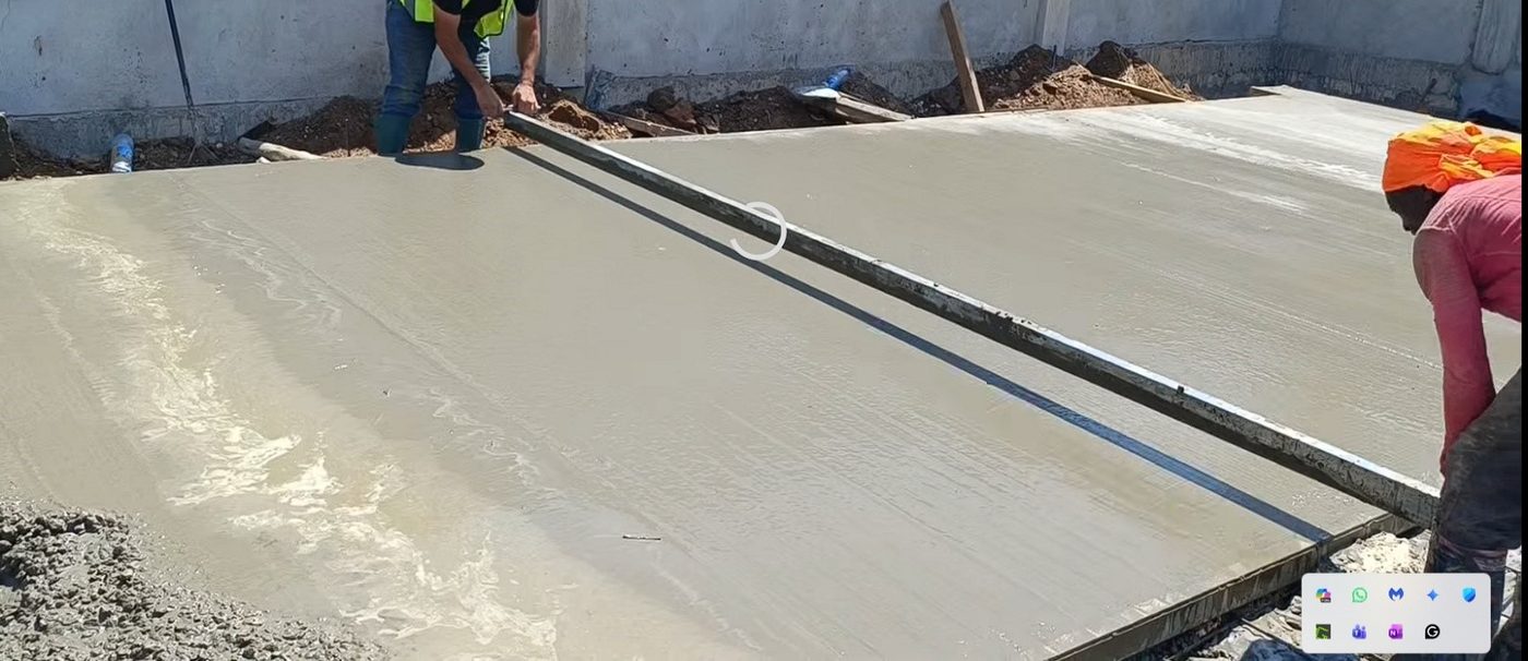 Levelling a fresh slab with a straightedge